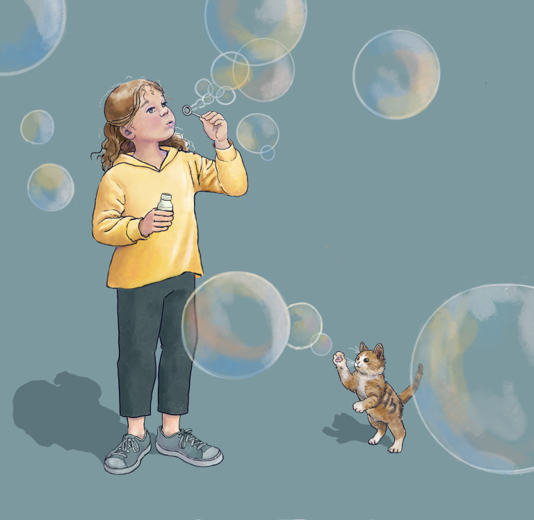 young girl blowing soap bubbles that are drifting toward viewer- kitten is swiping at one 