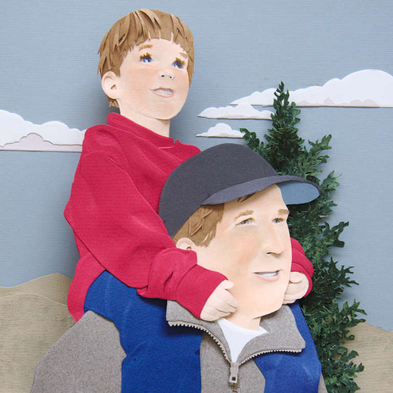 paper sculpture of father giving son a piggy-back